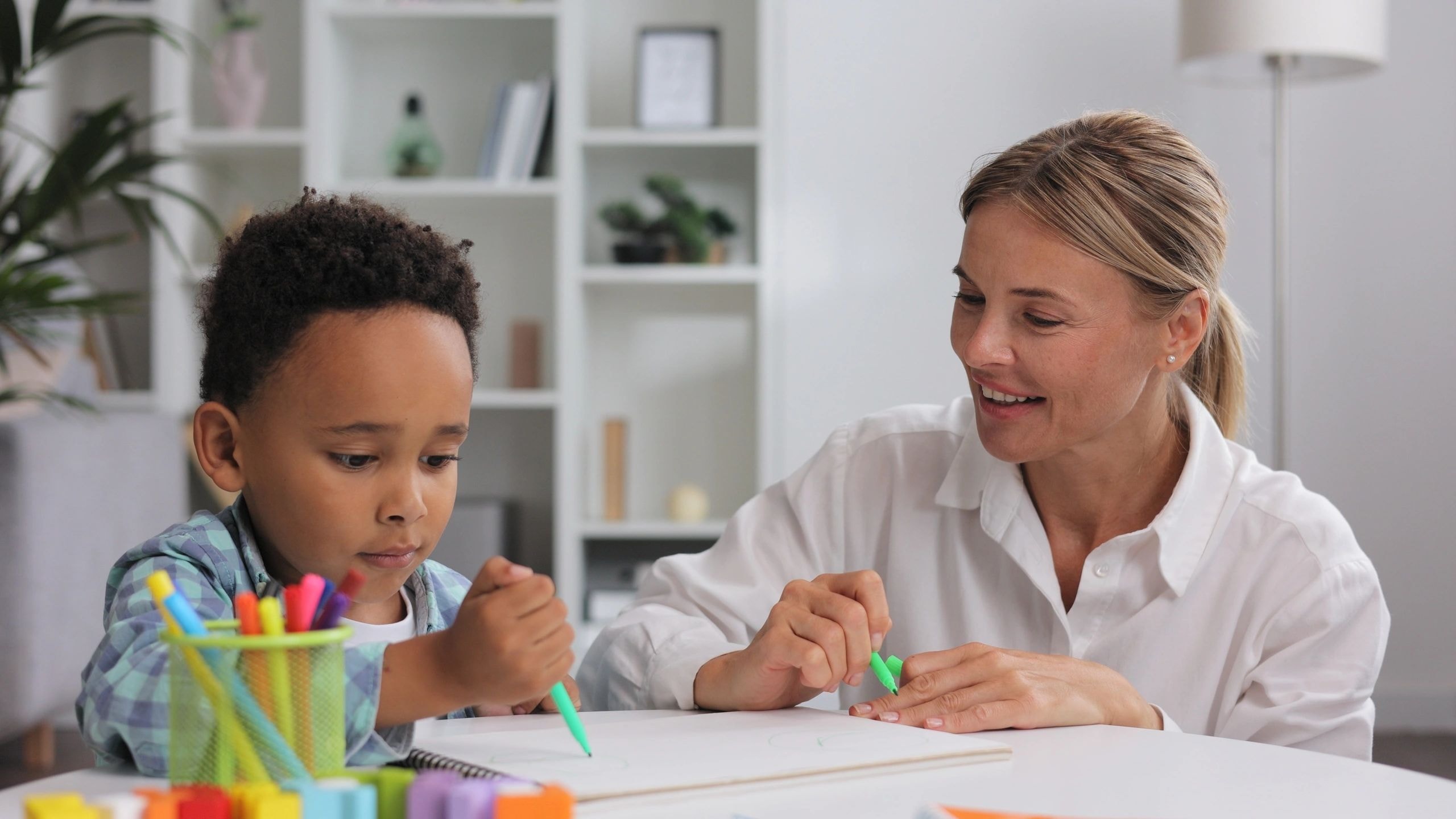 Teacher and child working together